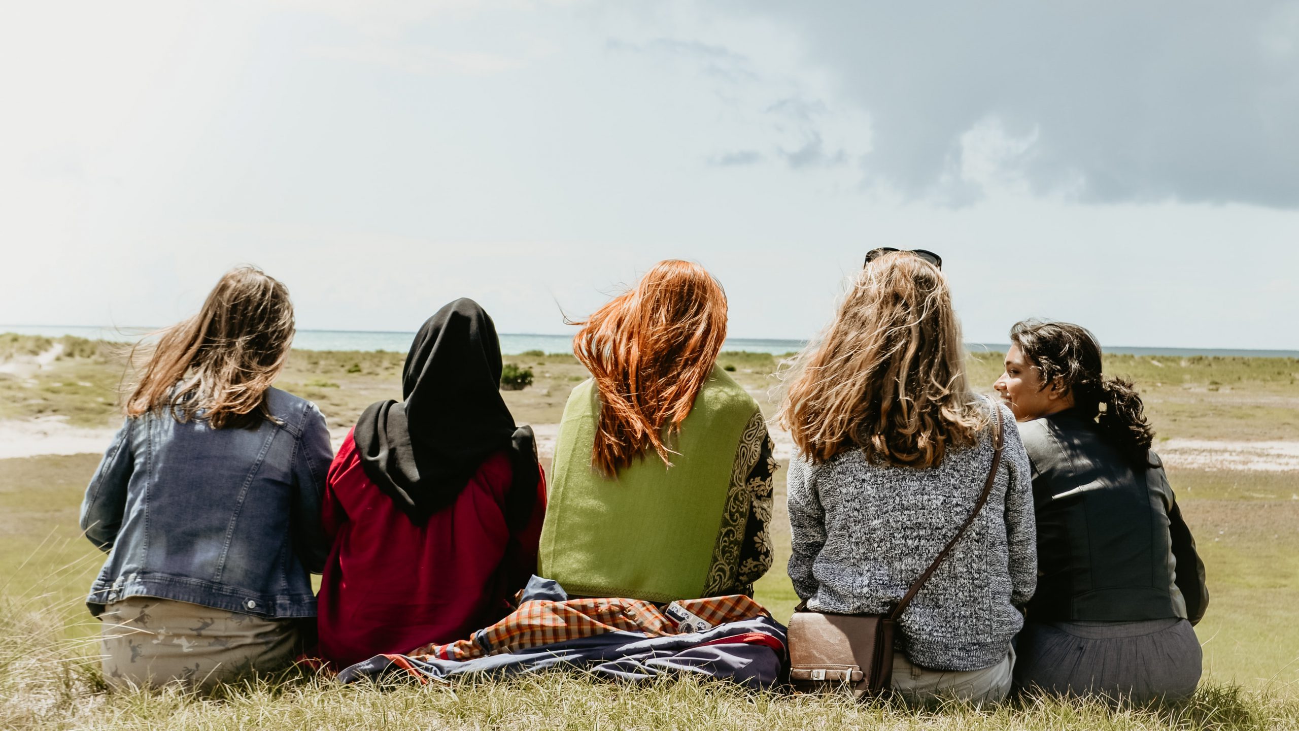 Friends sitting on a hill in France